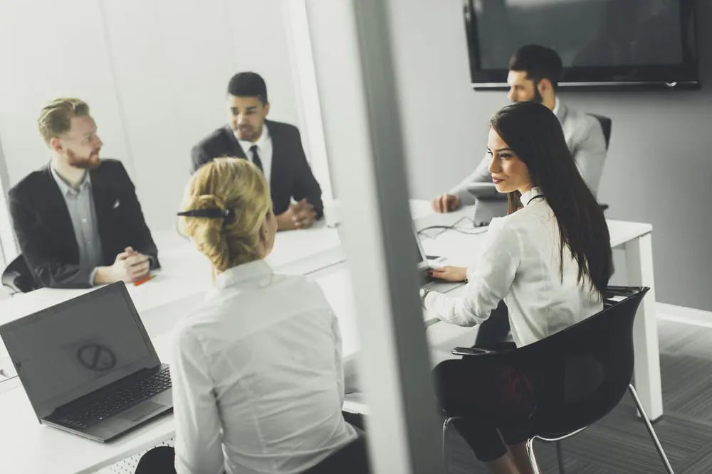 Business professionals utilizing temporary office space