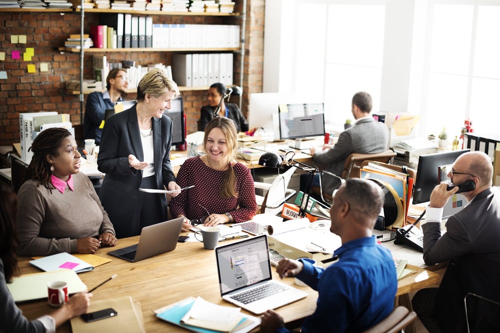 Employees in an open shared office space