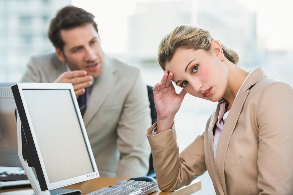 Woman frustrated by annoying coworker