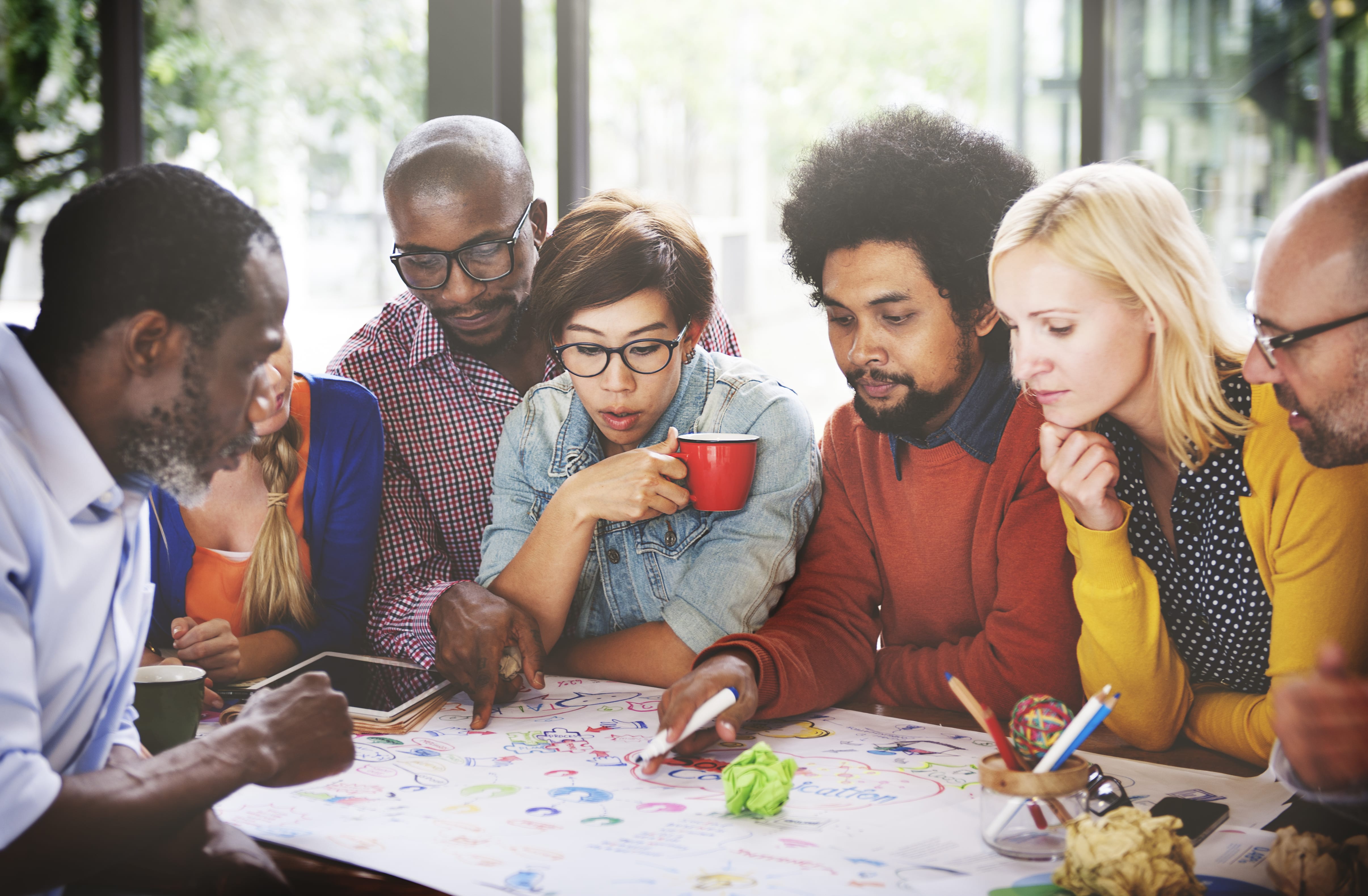 Diverse group of coworkers cooperating