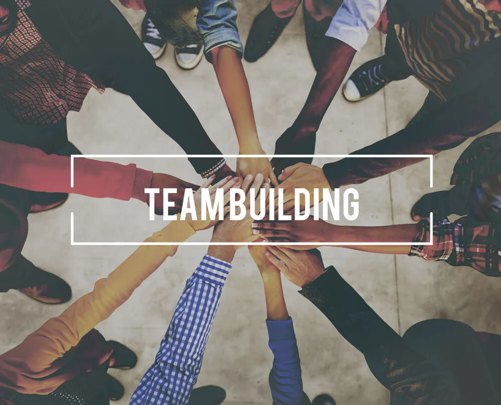 Diverse group of professionals joining hands